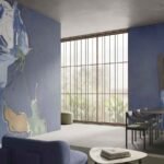 Blue abstract marble wallpaper with fluid organic shapes and white, cream and earthy accents in a modern interior