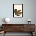 Minimalist bird and leaf wall frame featuring a modern nature-inspired illustration in deep green and earthy orange tones