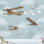 Airplane wallpaper for kids featuring vintage planes flying through clouds with birds