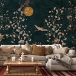 Luxury Chinoiserie wallpaper featuring cherry blossom branches, elegant cranes, birds, and a golden moon on a rich teal background for living rooms and luxury interiors.