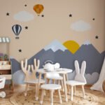 Kids wallpaper featuring mountains, hot air balloons, clouds, stars, and sunrise for nursery and children's bedroom interiors.